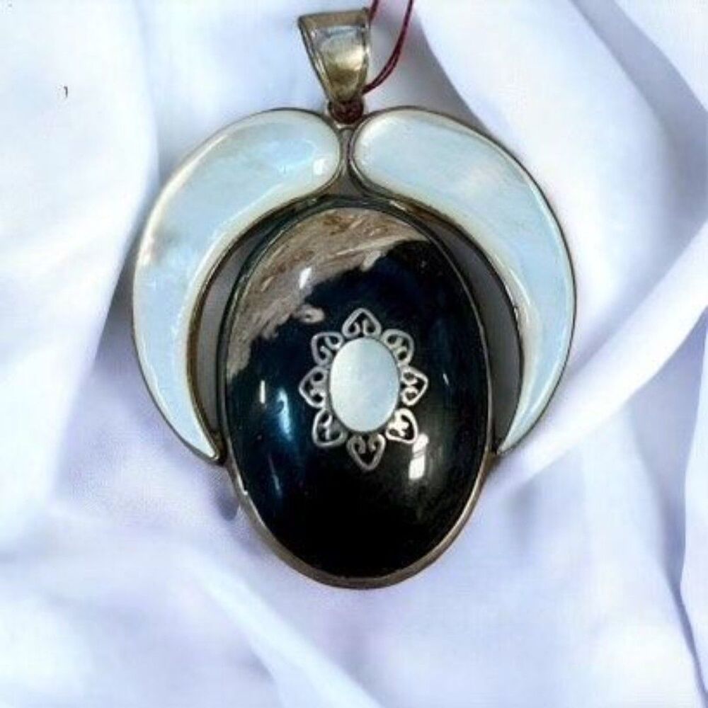 Sterling silver Agate Mother Of Pearl And Quartz Pendant marked 925 on clasp.